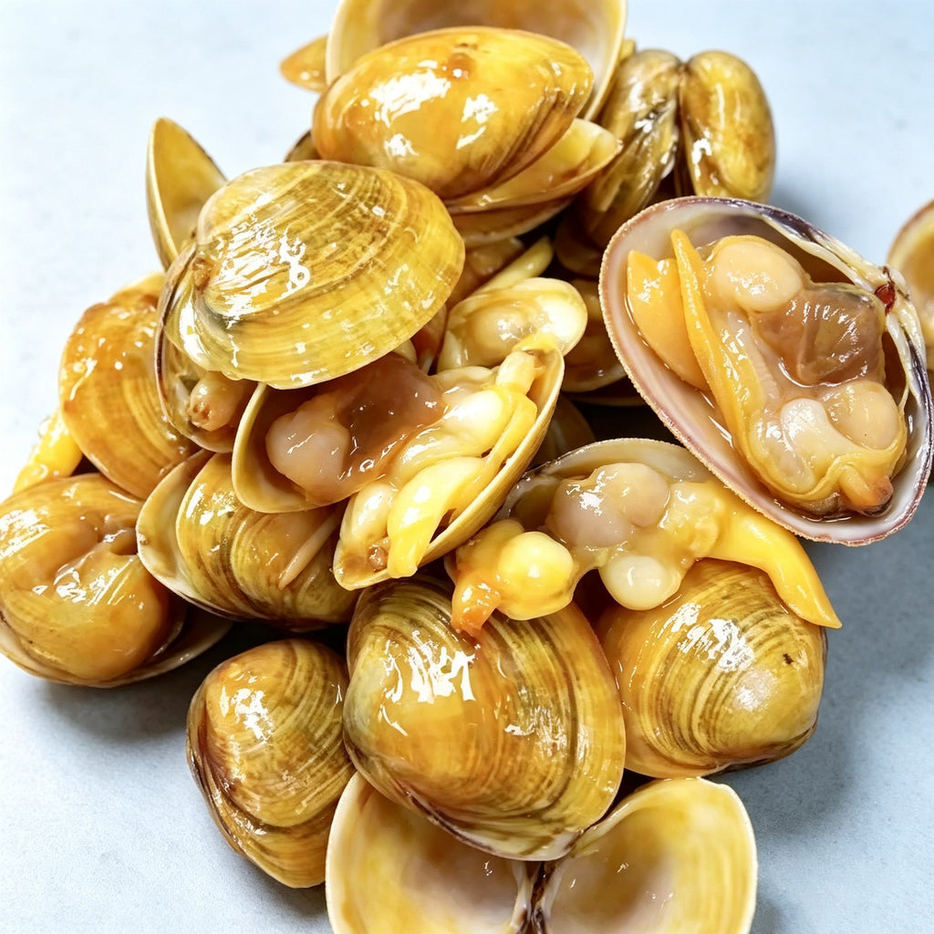 Golden-brown clams arranged on a plate before cooking